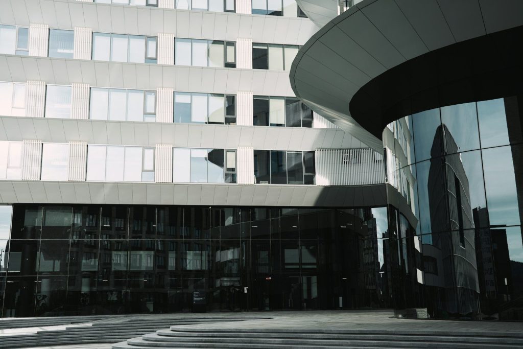 Sleek modern building with a curved glass entrance.