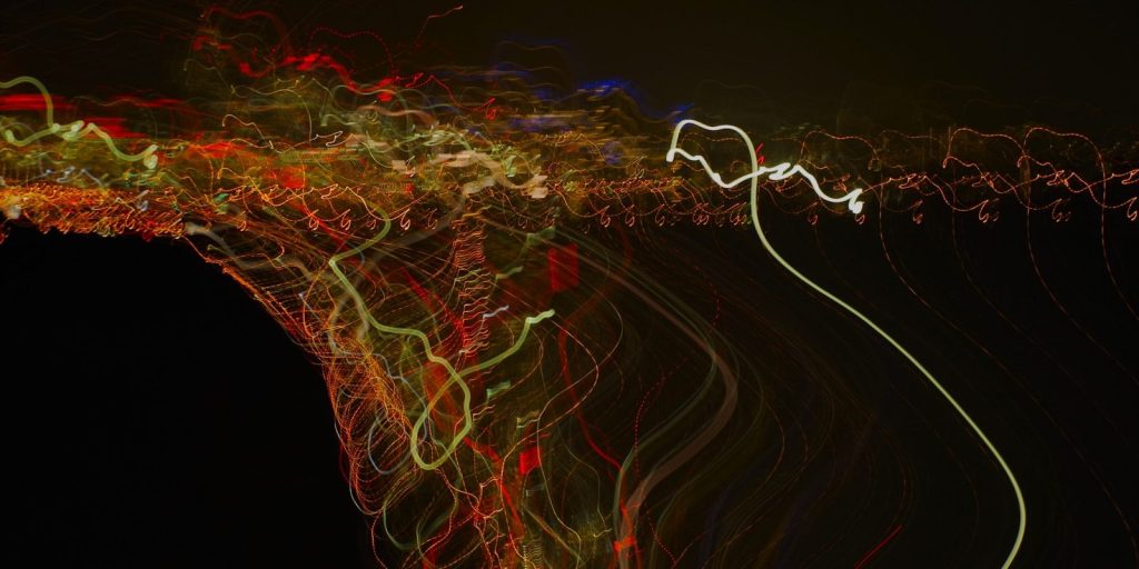Abstract light trails at night with dark background