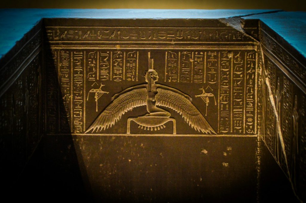 A picture of an egyptian temple in the dark