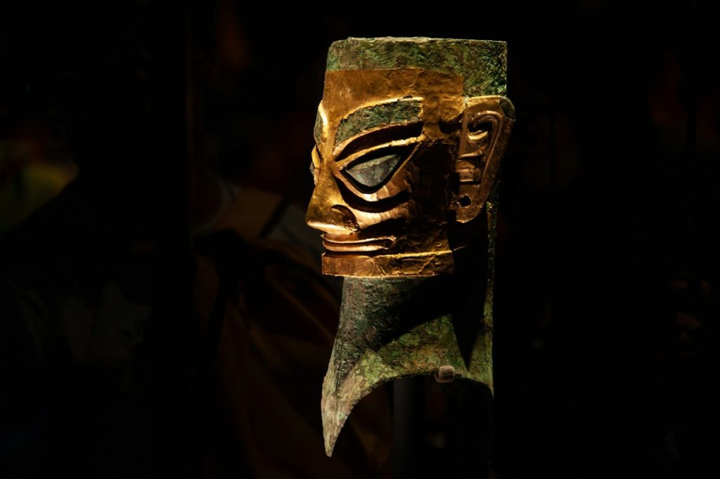A close up of a mask on a pole