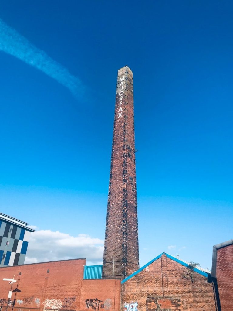 brown and white concrete building under blue sky during daytime