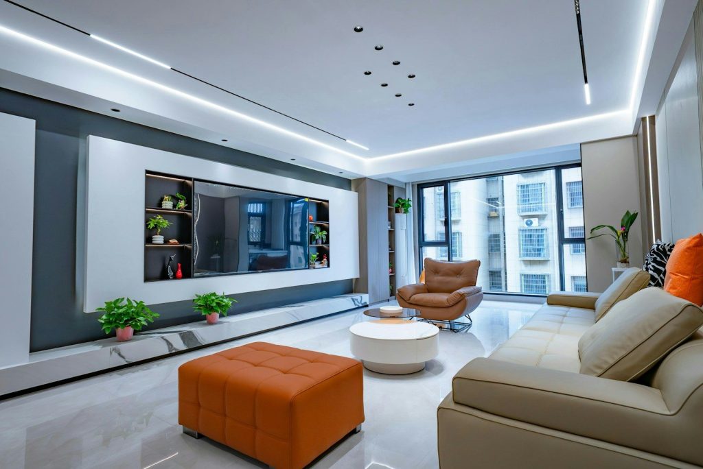 Modern living room with sleek furniture and large windows.