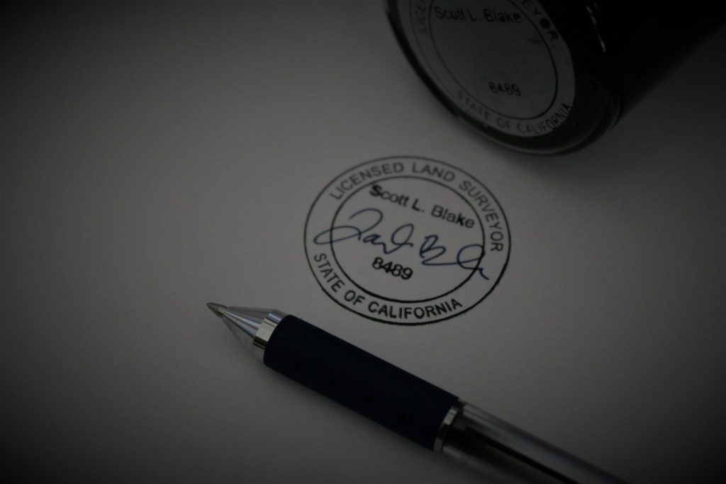 a pen sitting on top of a piece of paper