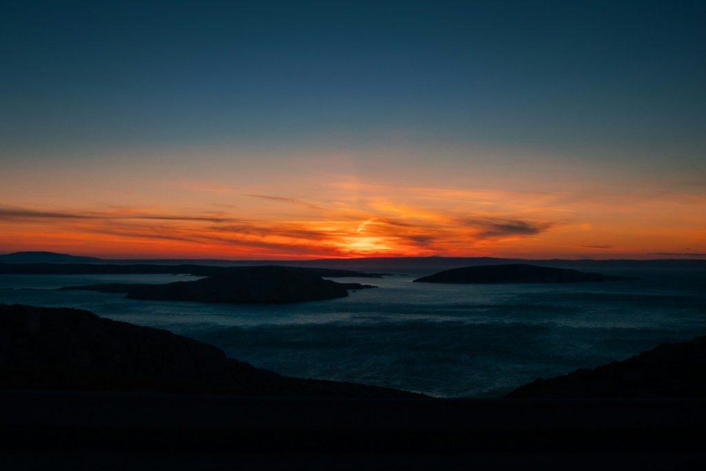 a sunset over a body of water