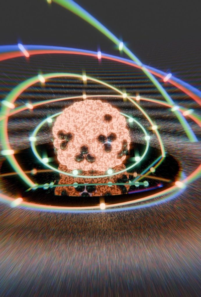 Stylized atom model with colorful orbiting energy paths.