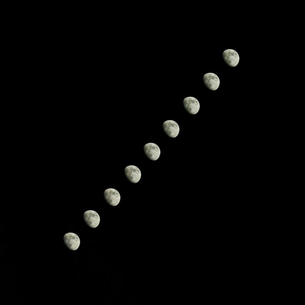 Sequence of moon phases against a black background