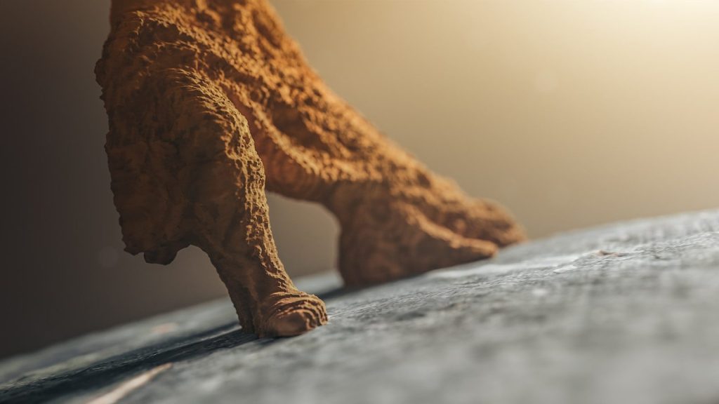 a close up of a person's foot on a bed