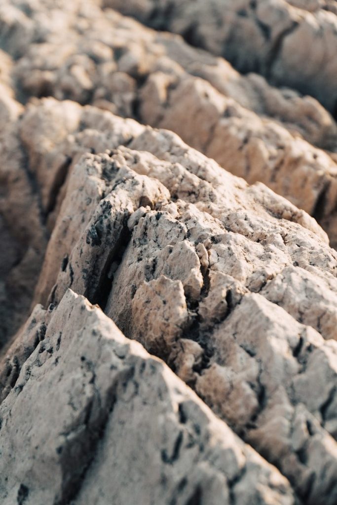 a close up of a rock formation with rocks in the background