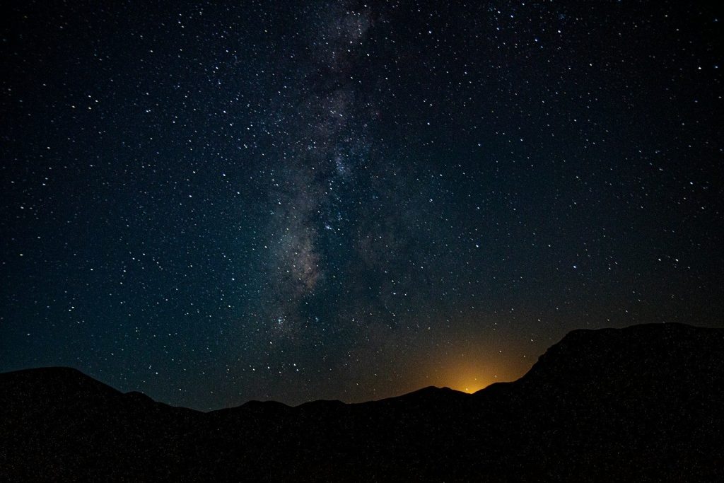 A view of the night sky with the milky in the distance