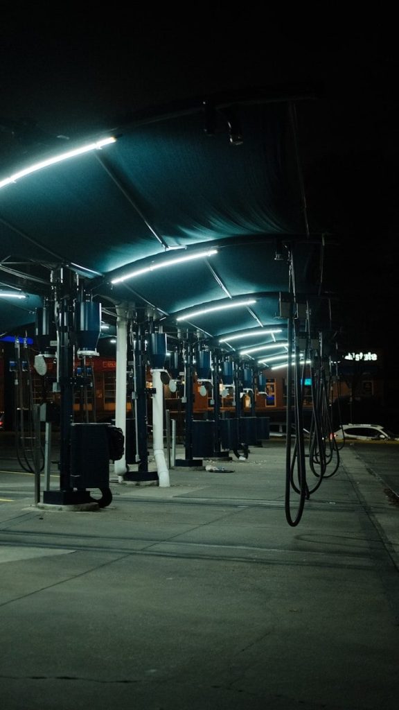 a row of gas pumps sitting next to each other