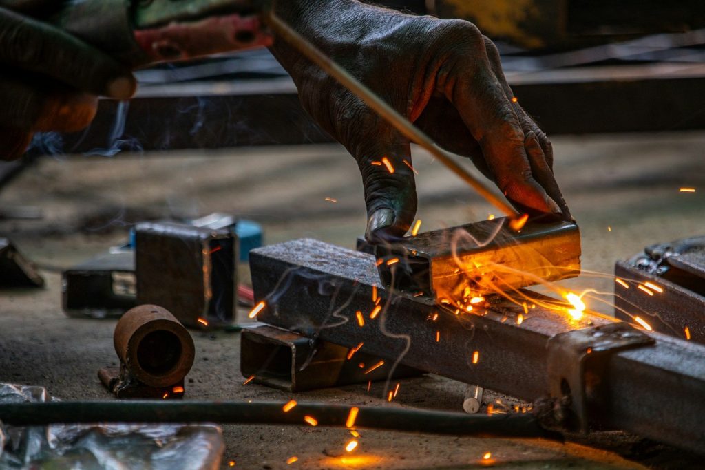 A man working on a piece of metal