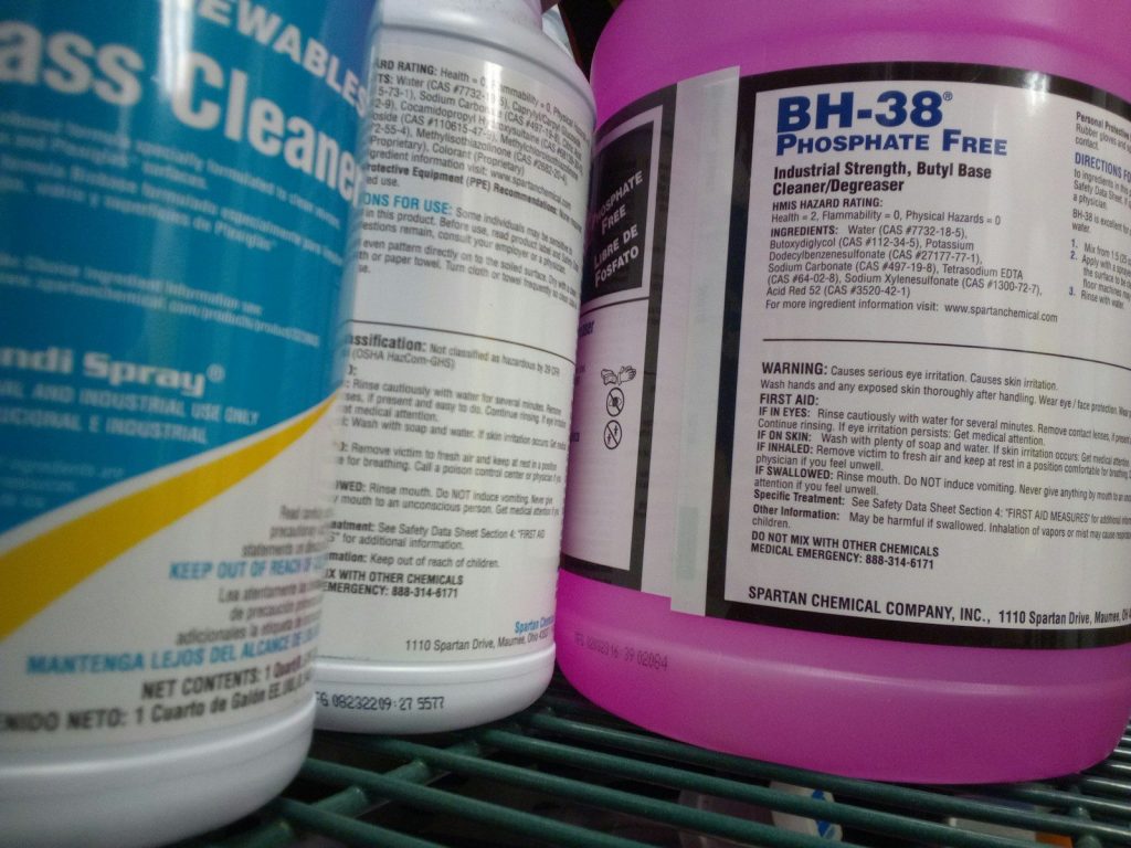 a close up of two bottles of cleaning products