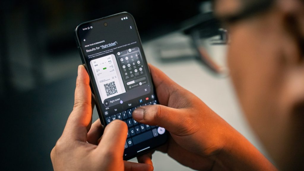 A man holding a smart phone in his hand