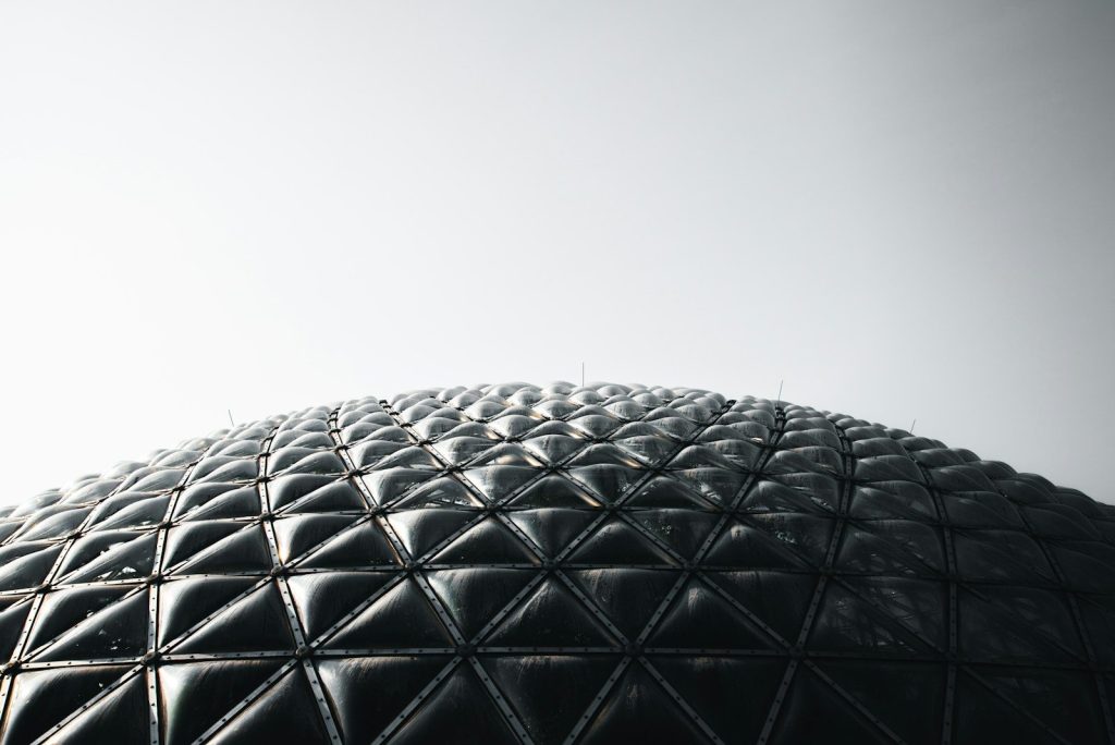 black round building under white sky during daytime