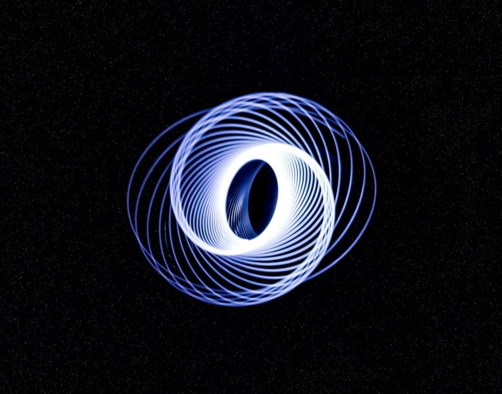 a circular object in the middle of a dark sky