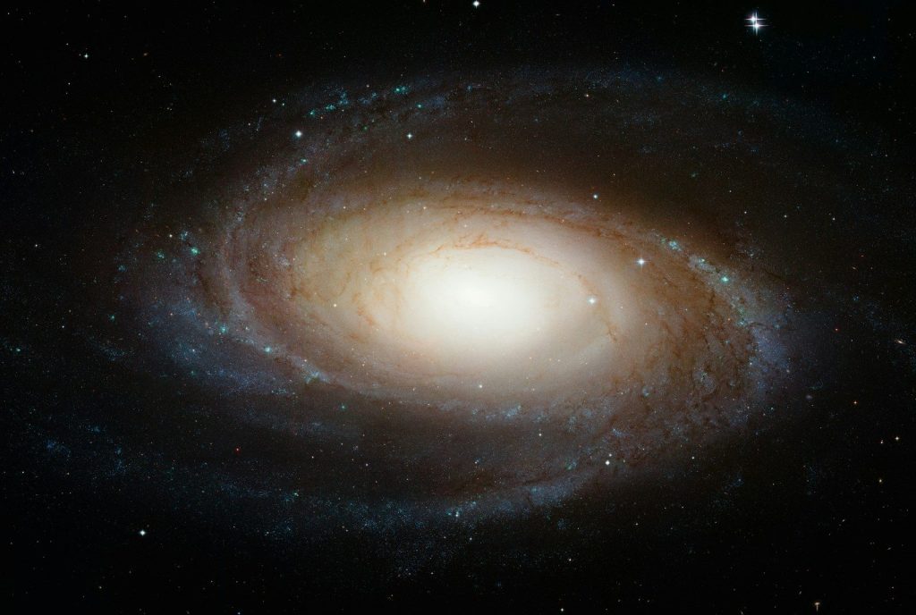 a spiral galaxy with stars in the background