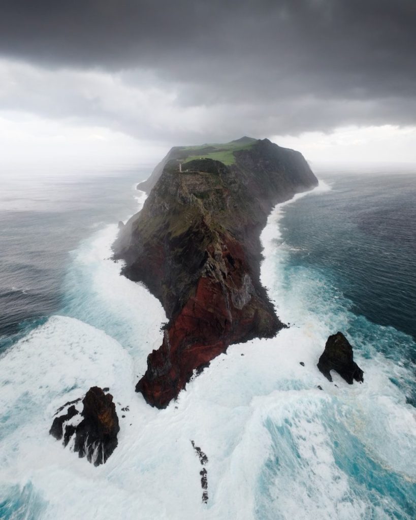 A large body of water next to a cliff