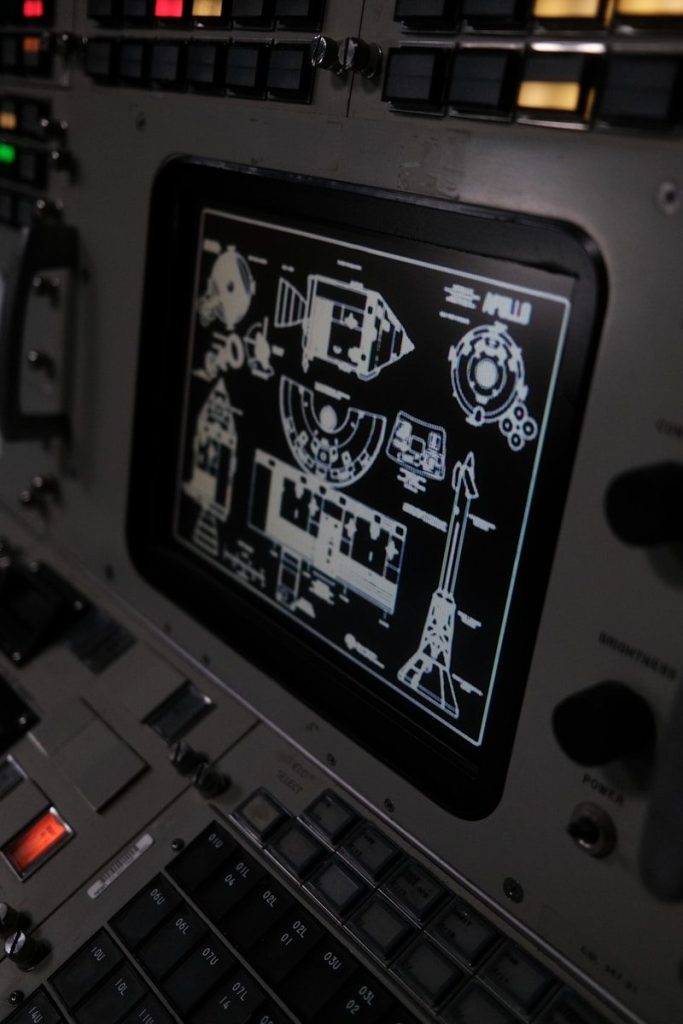 The control panel of a plane with a lot of buttons