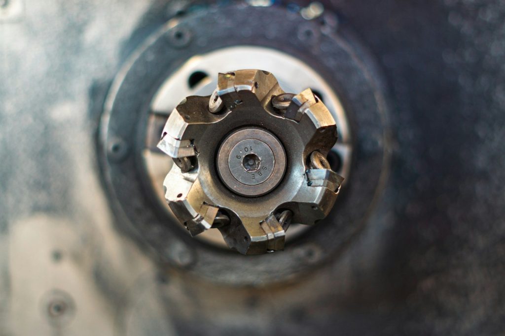 A close up of a metal object with a hole in it