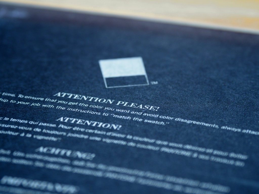 white card on blue textile