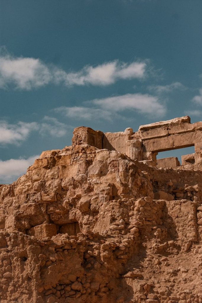 Ancient stone ruins against a blue sky