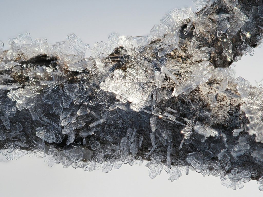 a close up of ice crystals on a white background