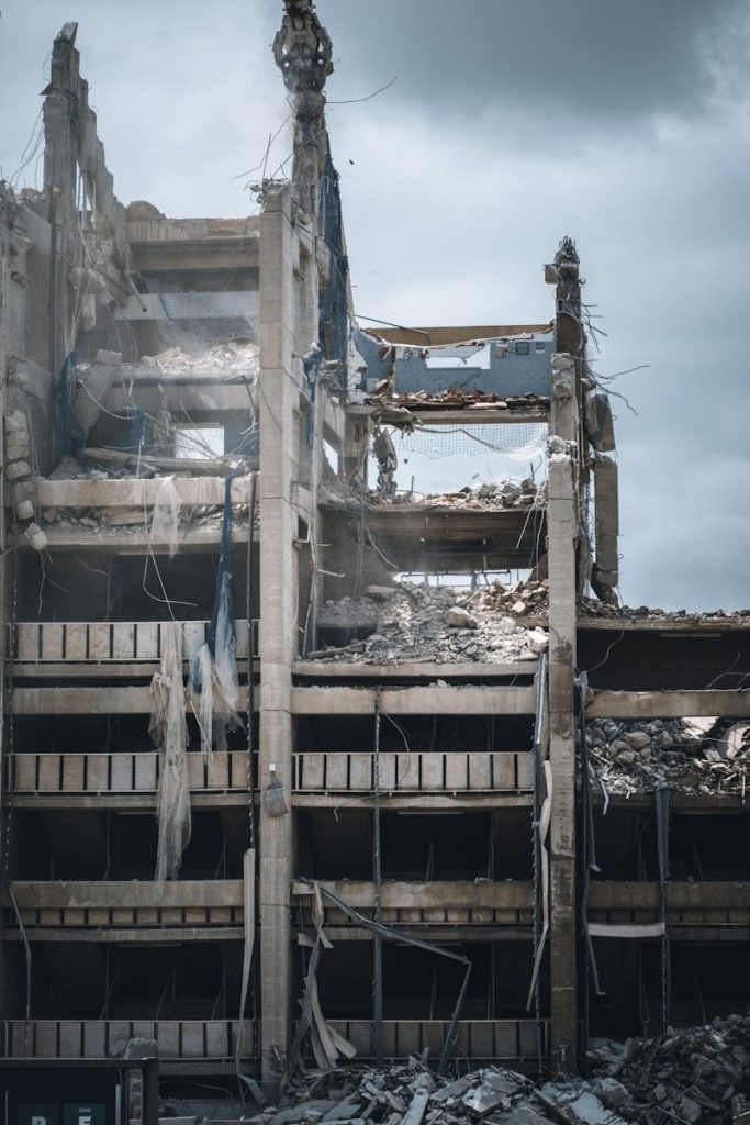 a very large building that has a bunch of rubble on it