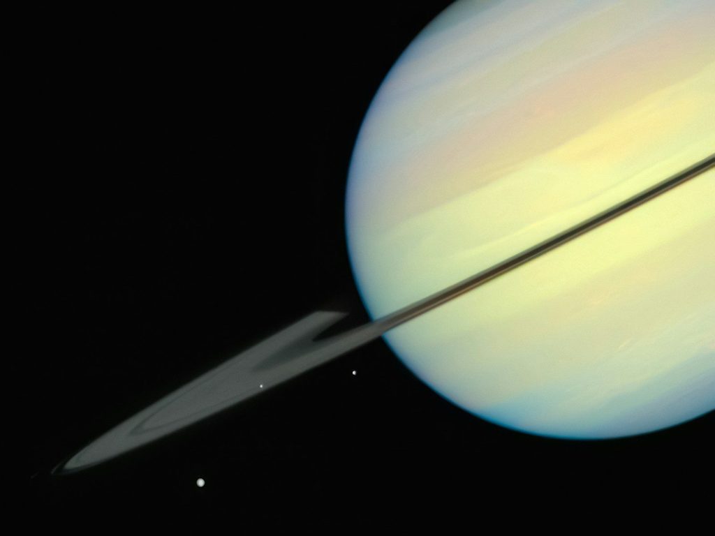 an image of saturn taken from space with a telescope