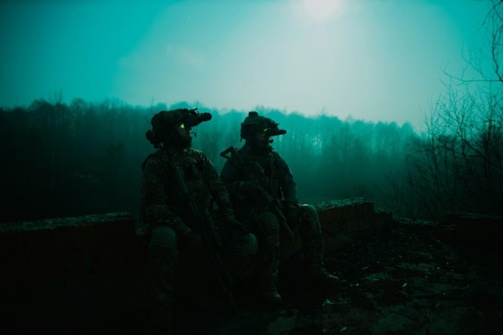 a couple of soldiers sitting next to each other