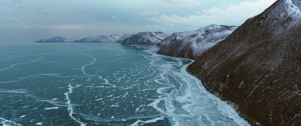 a large body of water surrounded by mountains