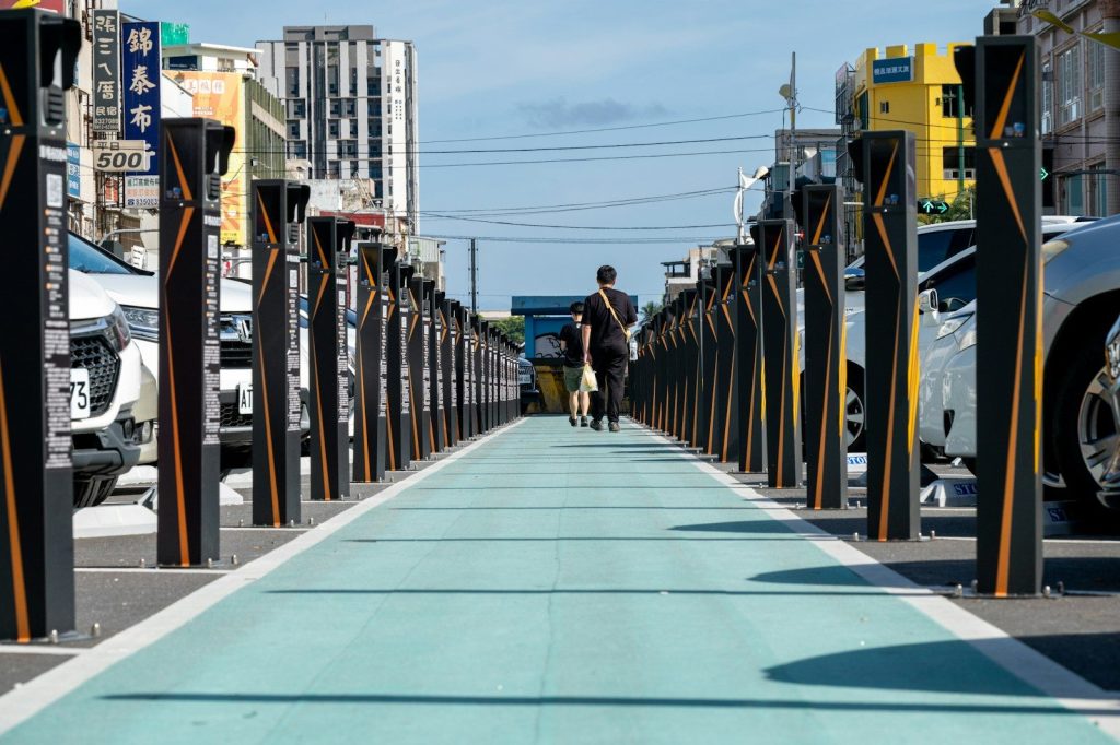Person walking dog on a bright blue path