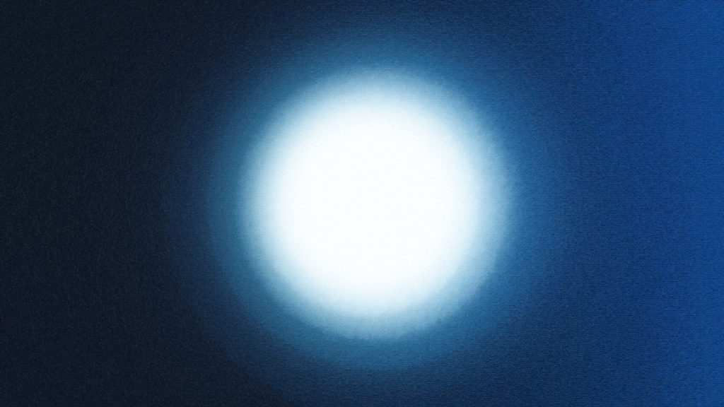 Bright white light against dark blue background