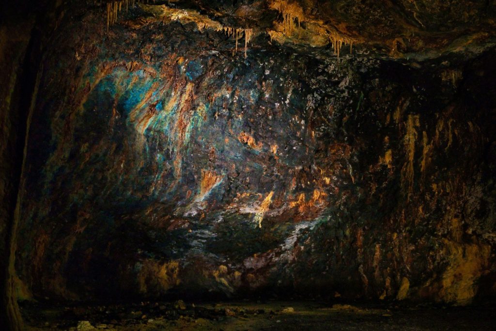 Colorful mineral deposits on cave wall