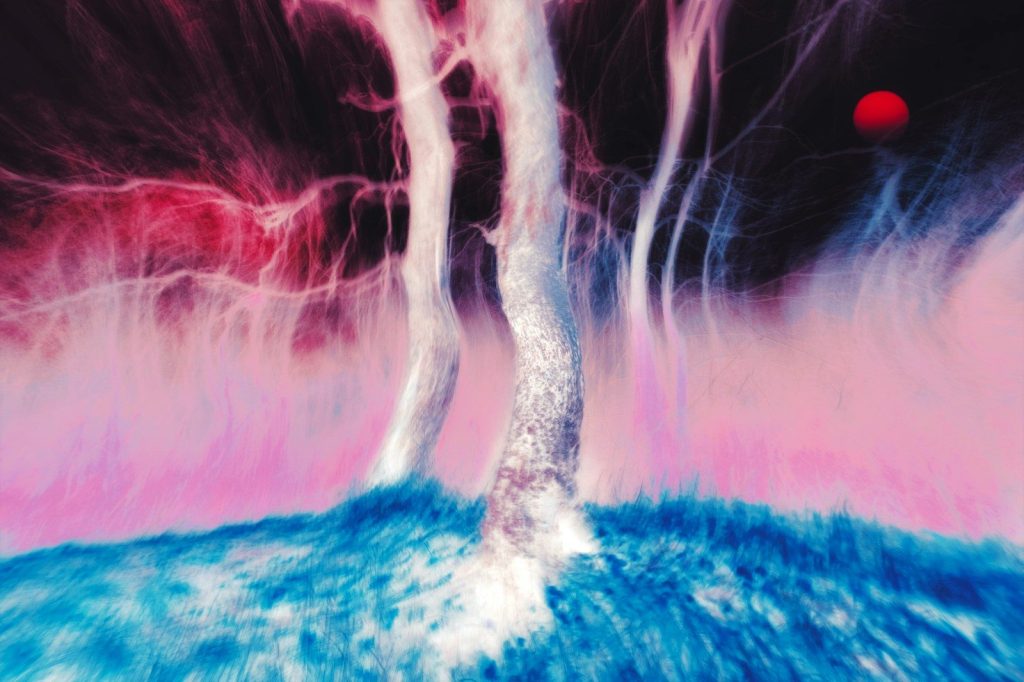 Abstract swirling colors with a red orb in the sky