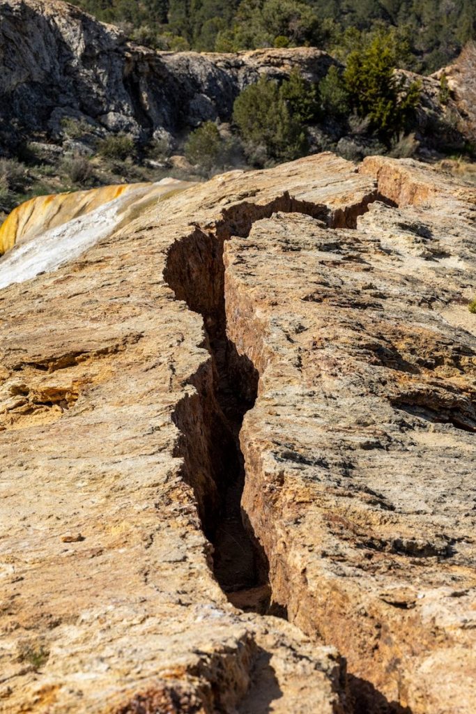 a rock with a crack in the middle of it