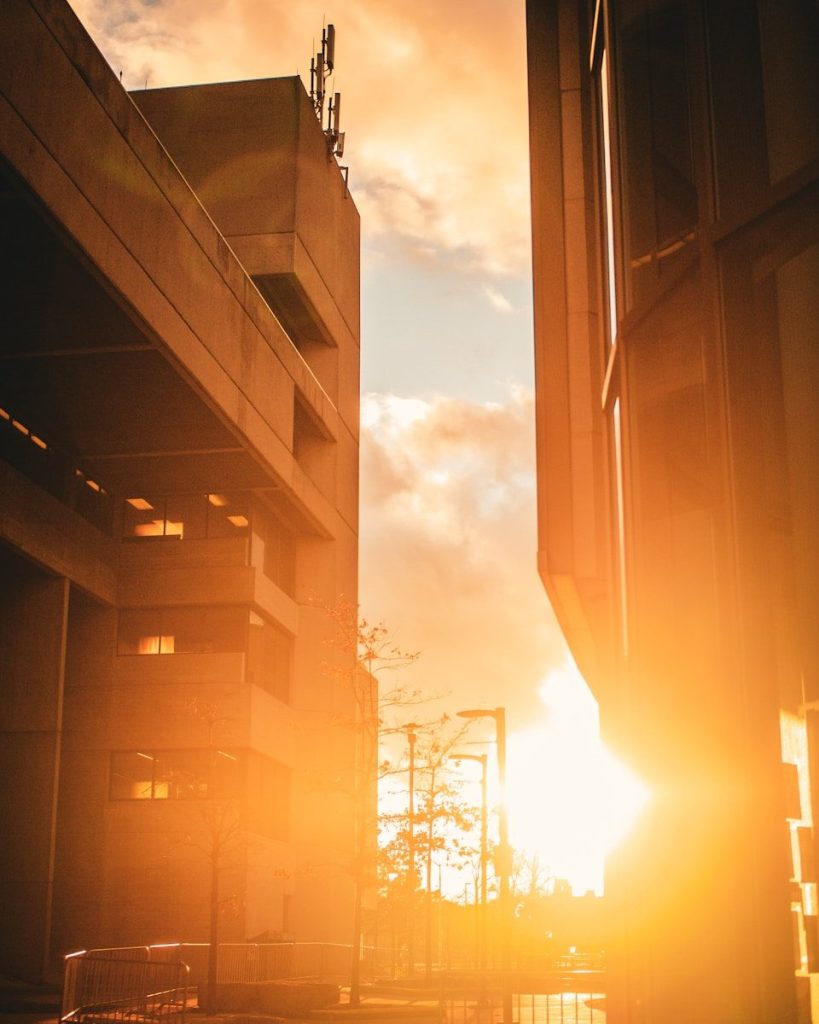 The sun is shining through the windows of a building