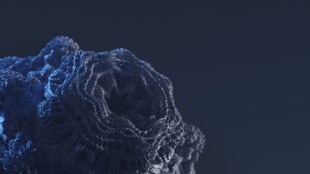 a close up of a blue rock on a black background