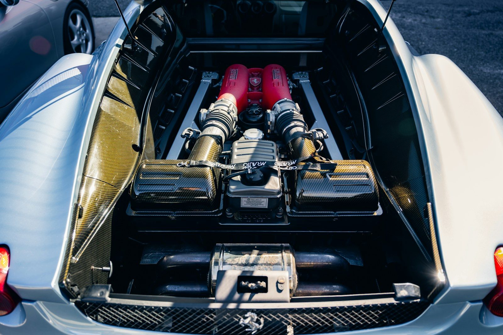 The powerful engine of a ferrari is shown.