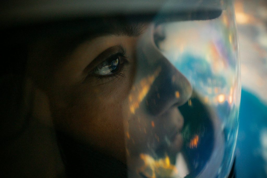 a close up of a person's face with a bubble in front of them