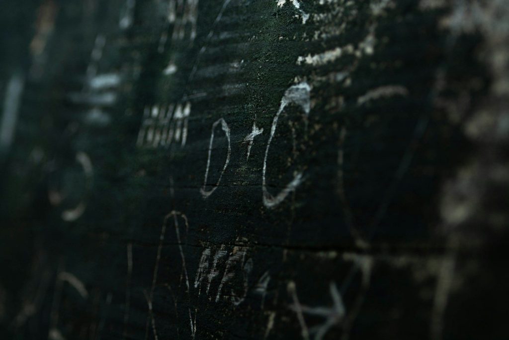 water droplets on black wooden surface