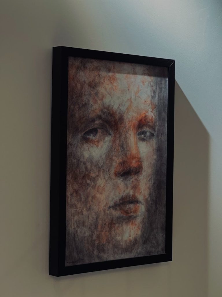 Framed abstract portrait of a pensive face