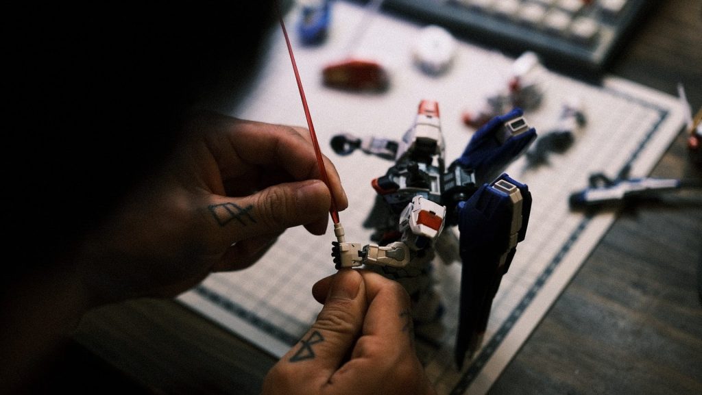a person is working on a toy airplane
