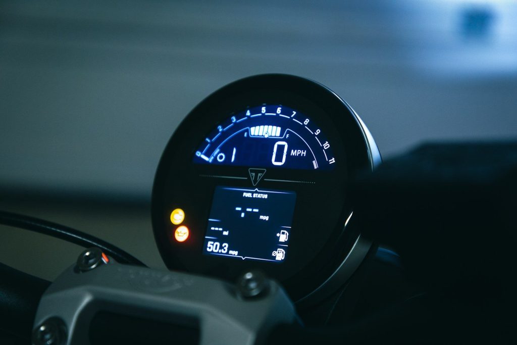 a close up of a speedometer on a motorcycle