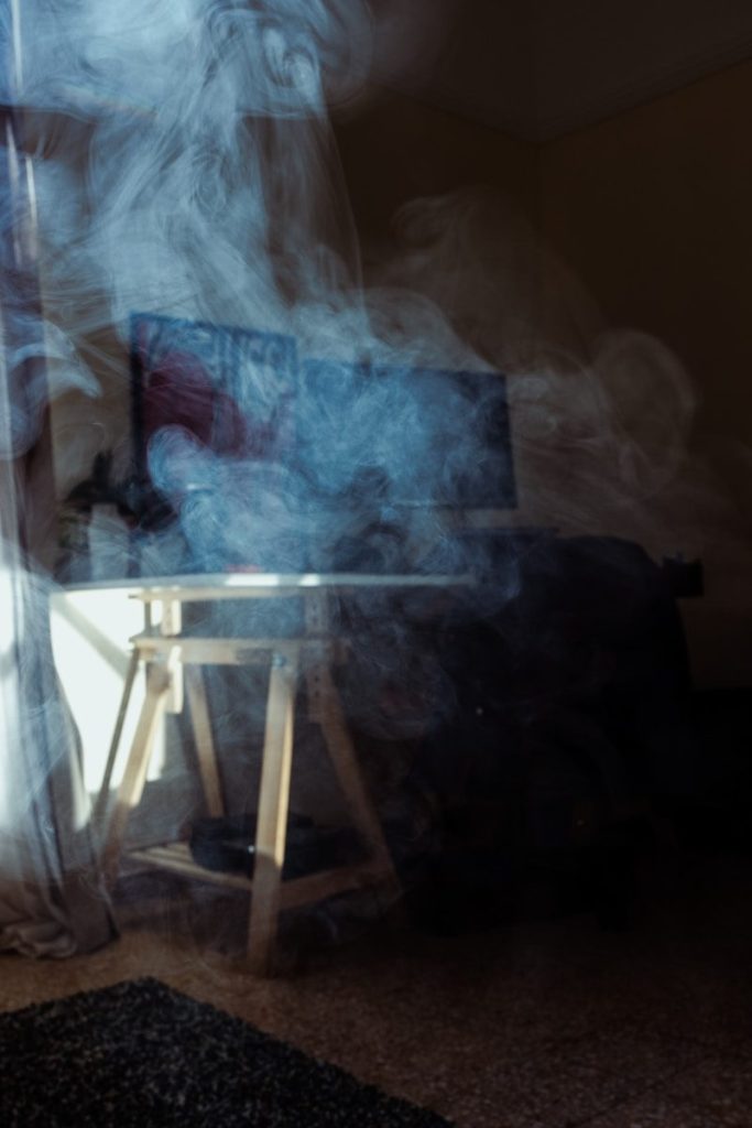 A blurry photo of a person sitting at a table