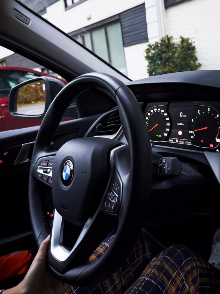 the steering wheel and dashboard of a car