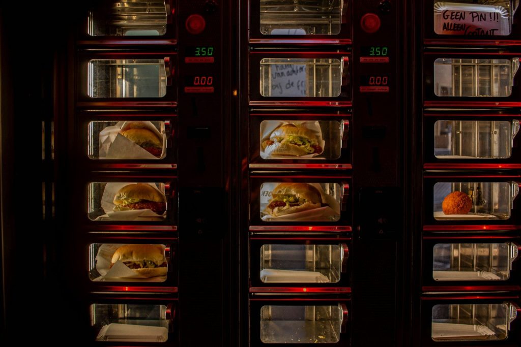 a bunch of hot dogs that are in a refrigerator