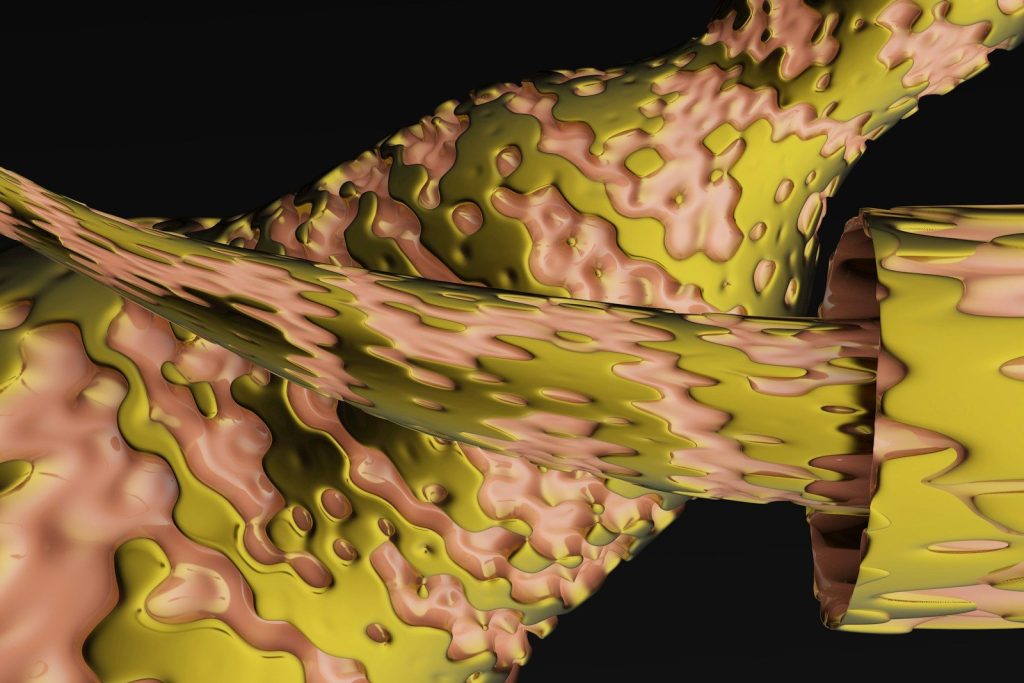 a close up of a yellow and pink object
