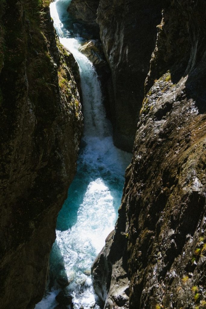 A river running through a canyon next to a cliff