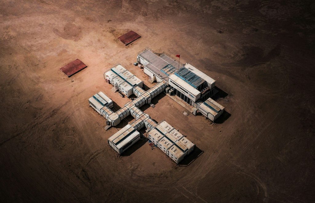 a group of trucks that are sitting in the dirt