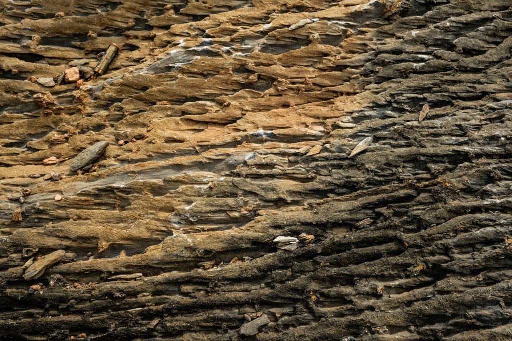 Close-up view of natural geological formations with rough texture and earthy tones.